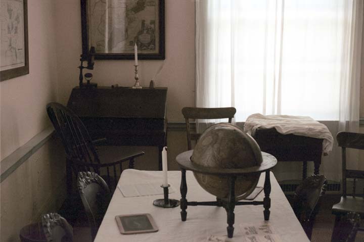 An office with a table and a globe.